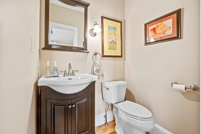 bathroom with toilet and vanity