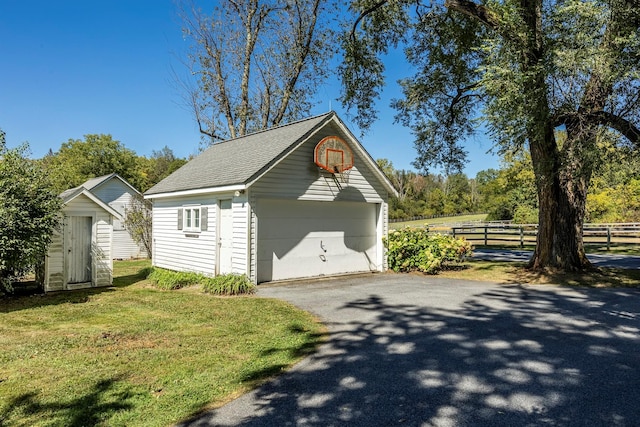 garage featuring a lawn