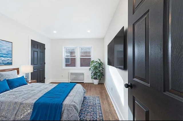 bedroom featuring dark hardwood / wood-style flooring