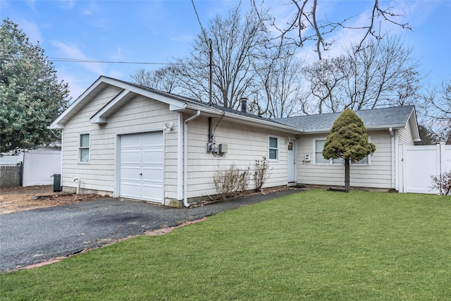 ranch-style house with a front lawn and a garage