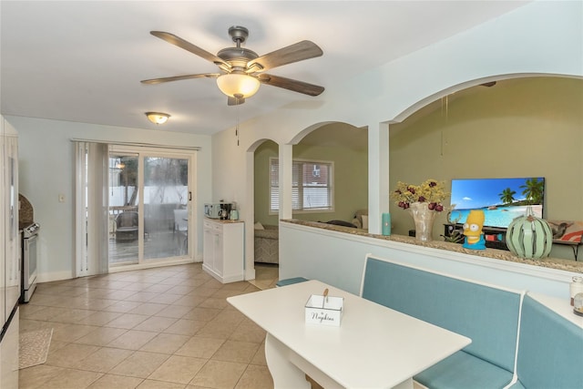 tiled dining room with ceiling fan