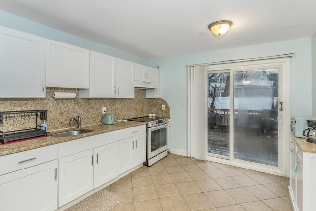 kitchen featuring light stone counters, sink, electric range, and white cabinets