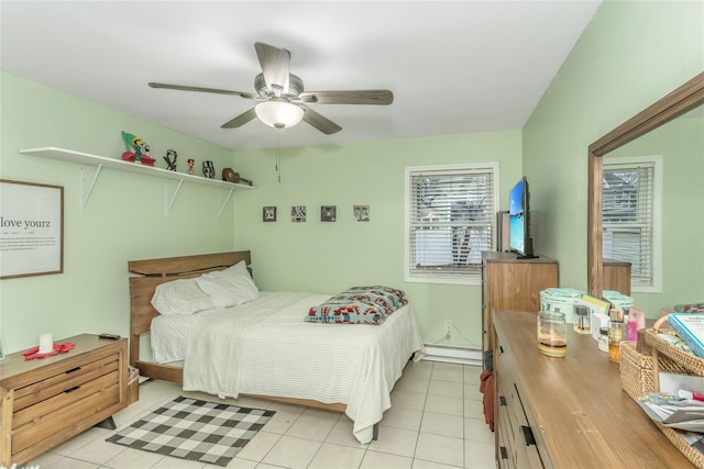 bedroom with ceiling fan, a baseboard heating unit, and light tile patterned flooring