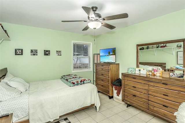 tiled bedroom with ceiling fan