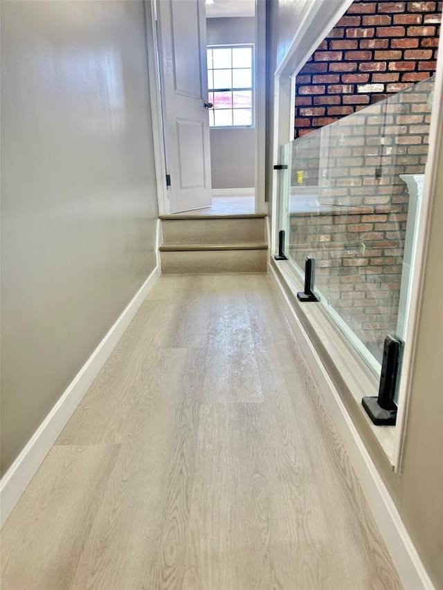 interior space featuring light wood finished floors and baseboards