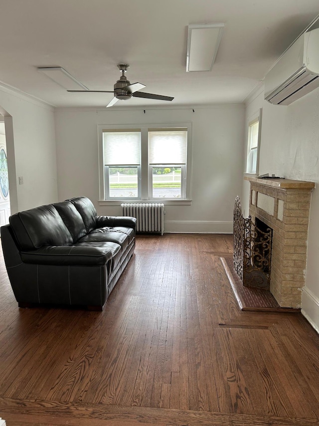 6 Felix Ct, Baldwin, NY 11510 - living area featuring radiator, a wall mounted AC, dark wood finished floors, a ceiling fan, and a fireplace