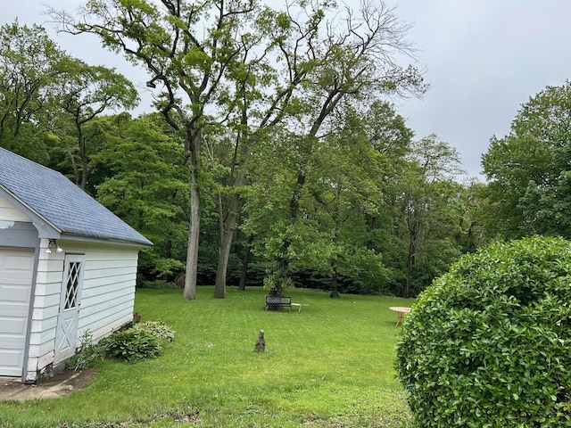 6 Felix Ct, Baldwin, NY 11510 - view of grassy yard featuring an outdoor structure