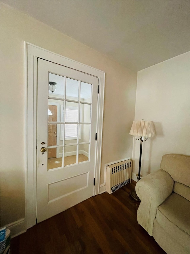 doorway featuring radiator and dark hardwood / wood-style flooring