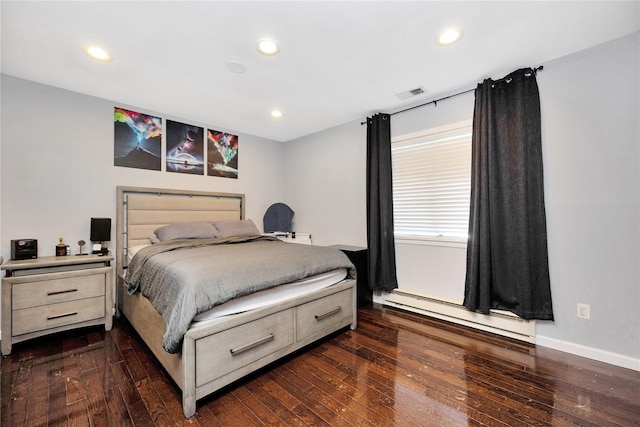 bedroom featuring dark wood-type flooring and a baseboard radiator