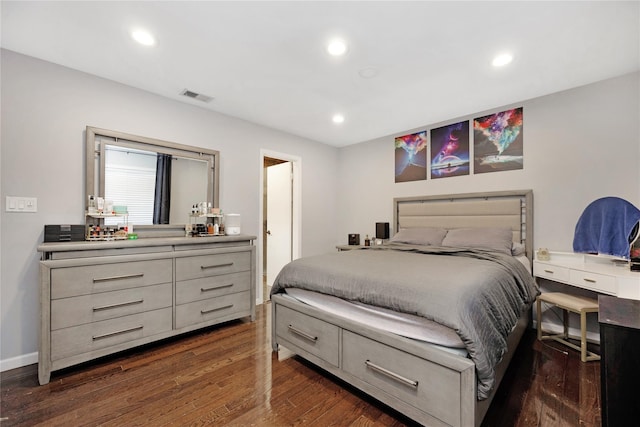 bedroom with dark hardwood / wood-style flooring