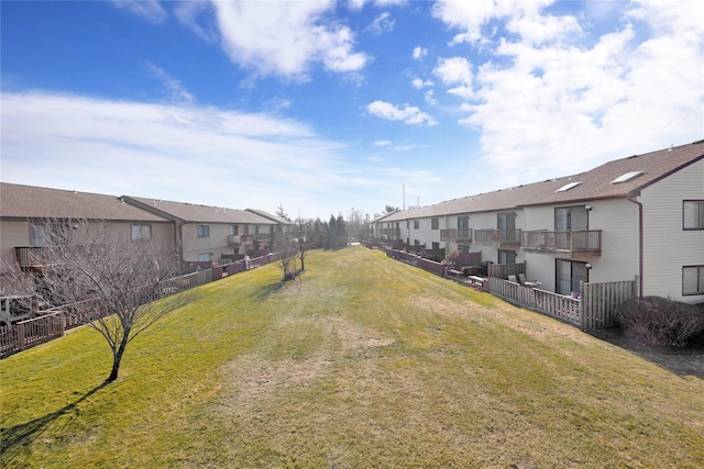 view of home's community with a yard