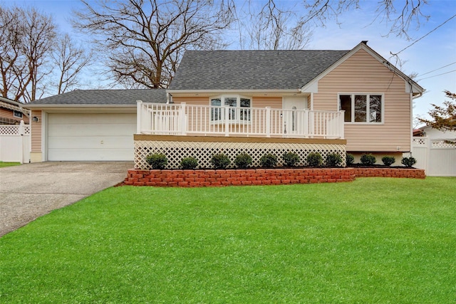 view of front facade featuring a garage, a deck, and a front lawn