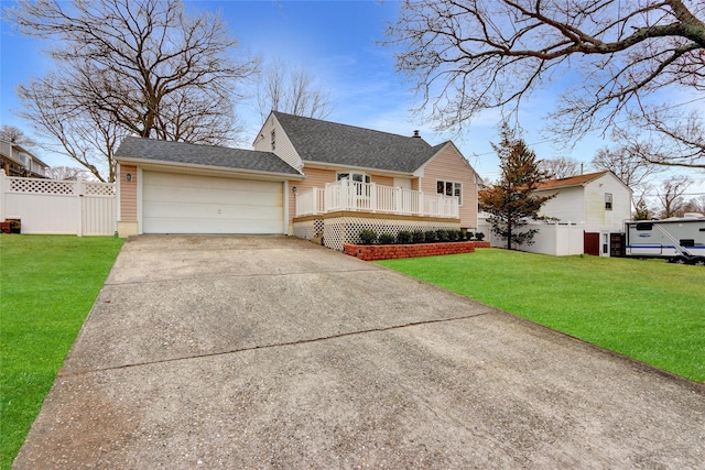 view of front facade with a front yard and a garage