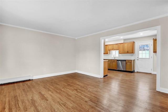 unfurnished living room with sink, ornamental molding, baseboard heating, and wood-type flooring