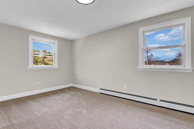 unfurnished room featuring a baseboard radiator and carpet