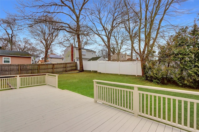 wooden terrace with a lawn