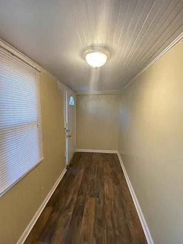 corridor featuring dark hardwood / wood-style floors