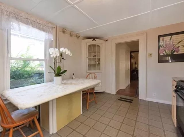 dining area featuring tile patterned flooring