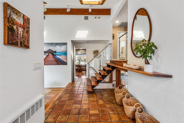 foyer with beam ceiling