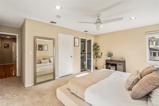 bedroom featuring ceiling fan and light colored carpet