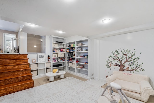 living area featuring light tile patterned floors and built in features