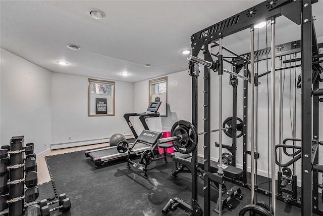 workout room featuring baseboard heating