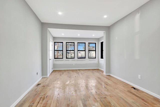 spare room with light wood-type flooring