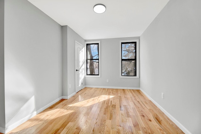 spare room featuring light hardwood / wood-style flooring