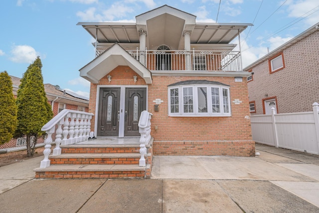 view of front of home with a balcony