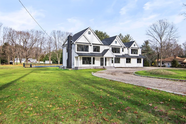 view of front of property with a front lawn