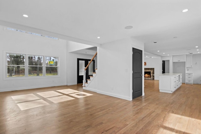 unfurnished living room with light wood-type flooring