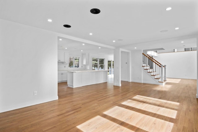 unfurnished living room featuring light hardwood / wood-style floors