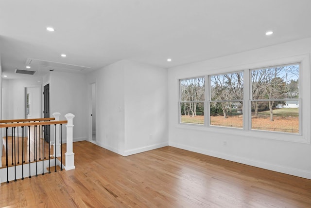 unfurnished room with light hardwood / wood-style flooring