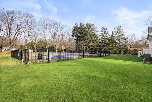 view of yard featuring a covered pool