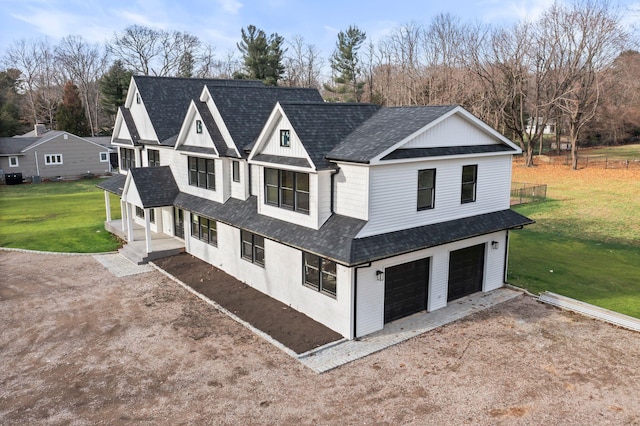 exterior space with a garage and a front lawn