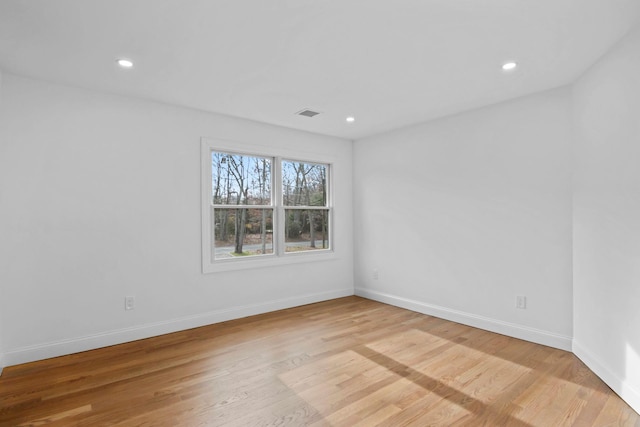 spare room with light hardwood / wood-style floors