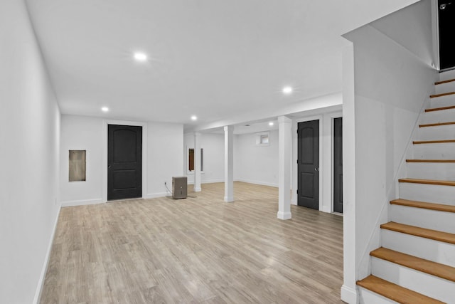 basement featuring light hardwood / wood-style floors