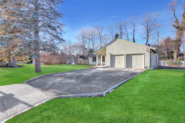 view of front of property featuring a garage and a front lawn