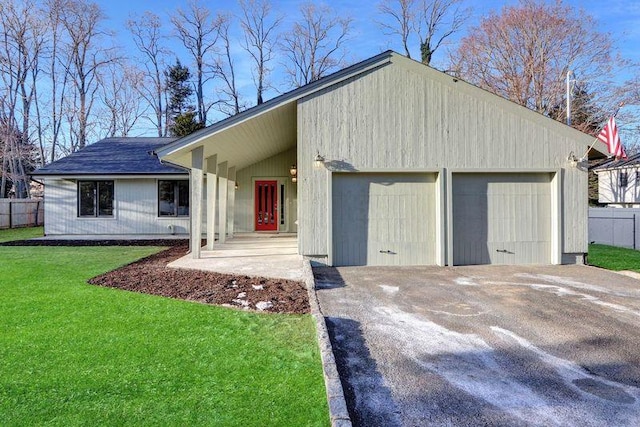 single story home with a garage and a front yard