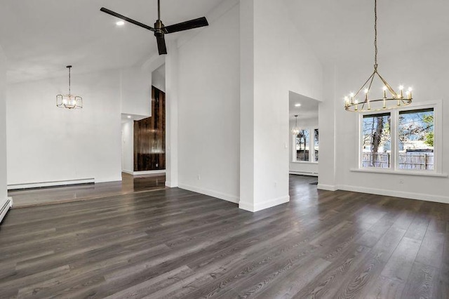 unfurnished living room with an inviting chandelier, a baseboard radiator, dark hardwood / wood-style floors, and high vaulted ceiling