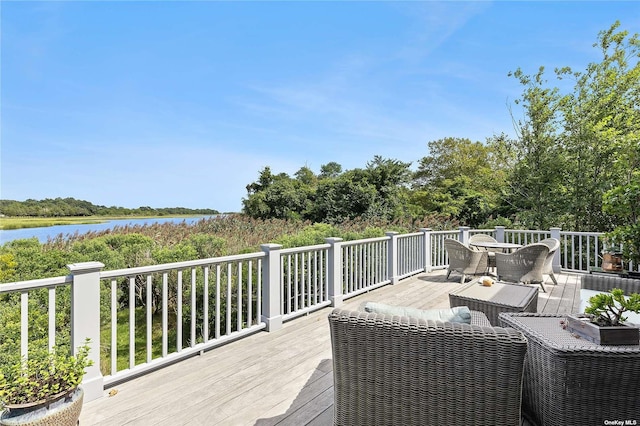 deck featuring a water view