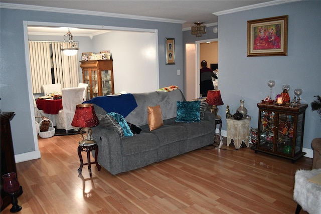 living room with wood-type flooring and crown molding