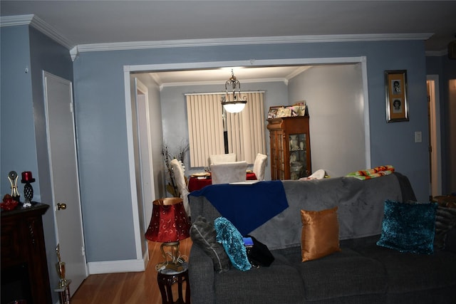 living room featuring wood-type flooring and ornamental molding