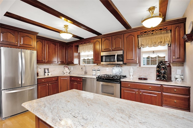 kitchen with stainless steel appliances, light stone countertops, beam ceiling, light hardwood / wood-style flooring, and sink