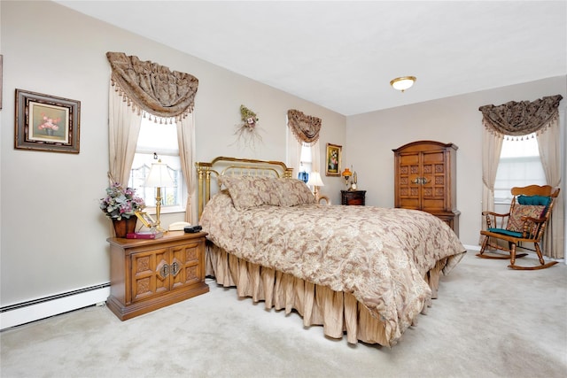 bedroom with baseboard heating, multiple windows, and carpet