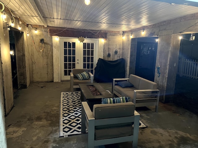 view of patio / terrace featuring french doors and an outdoor living space with a fire pit