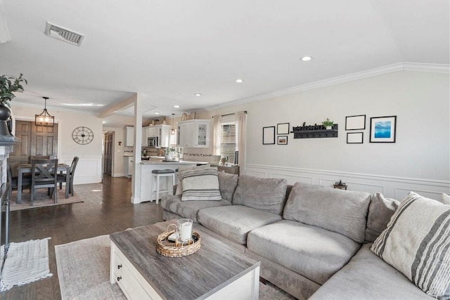 living room featuring crown molding and dark wood-type flooring