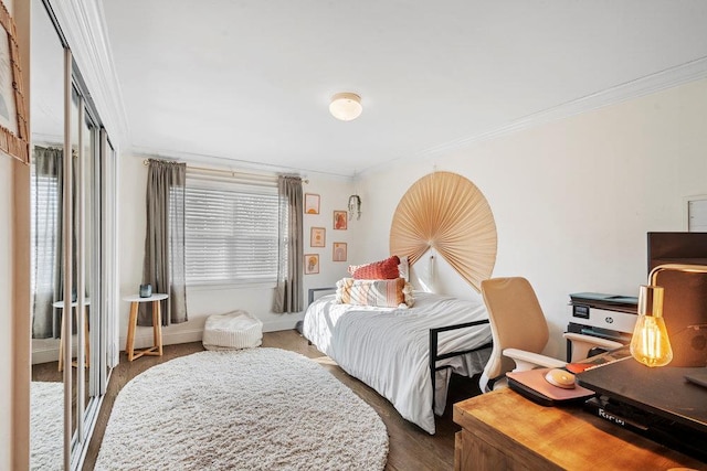 bedroom featuring multiple windows, crown molding, and dark hardwood / wood-style floors