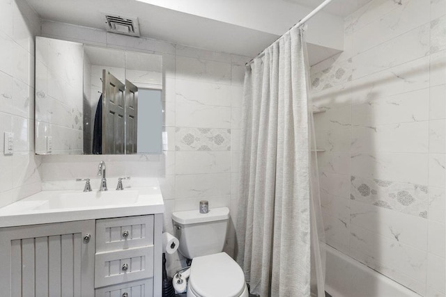 full bathroom featuring vanity, toilet, and shower / tub combo