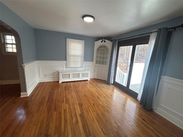 interior space featuring radiator and hardwood / wood-style floors